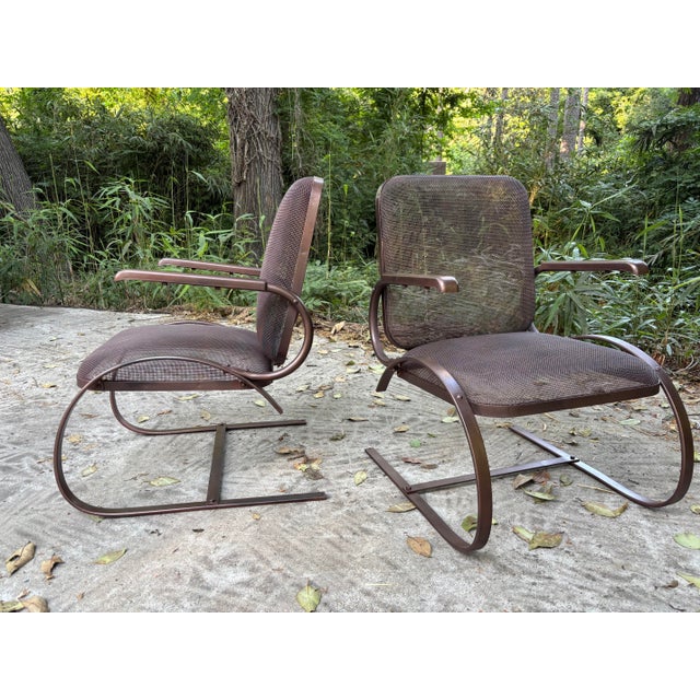 restored cantilever pair of mid century modern rockers, sanded primed and painted in a dark copper hue. 33 tall and...