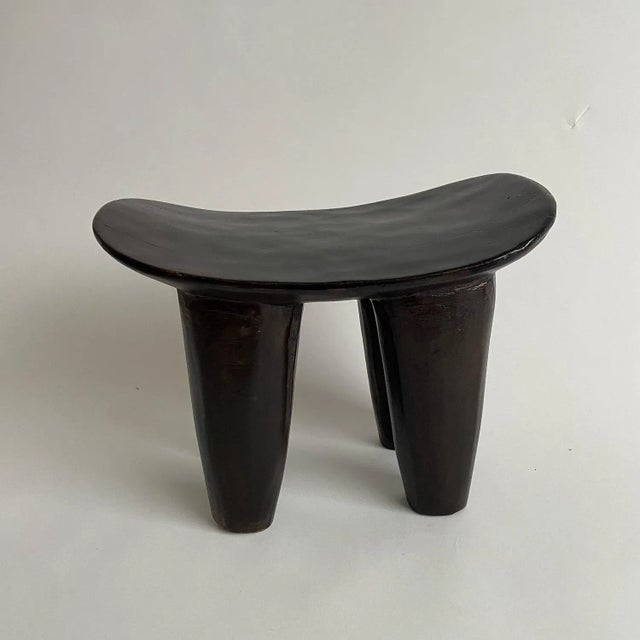 A wonderful beautiful example of an African Senufo stool. This authentic artisanal Afrifcan stool is in a dark stained...