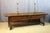 Large oak table or side table resting on four baluster legs joined by a stretcher. This table features two sliding drawers...