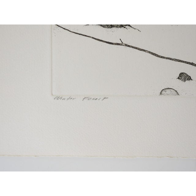 Late 20th century etching on cream paper of a snowy winter forest landscape by Art Hansen (1929-2017) Washington. Signed,...