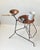Rare small light-weight hybrid side table made from bend and welded string iron in black paint. It features a guitar pick...