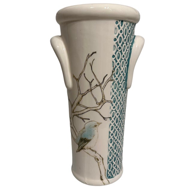 Vintage decorative ceramic vase featuring a hand-painted bird on a branch motif and a textured turquoise geometric panel.