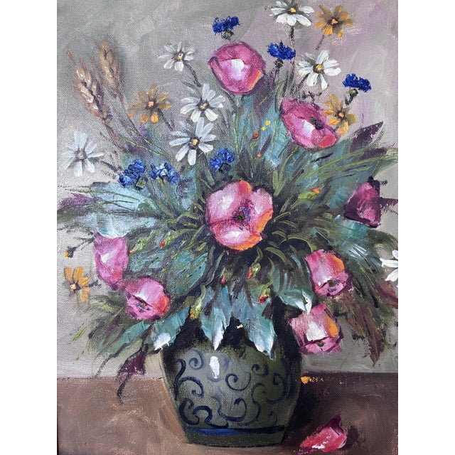 This original vintage oil painting from the 1960s shows a vibrant bouquet of wildflowers arranged in a ceramic vase....