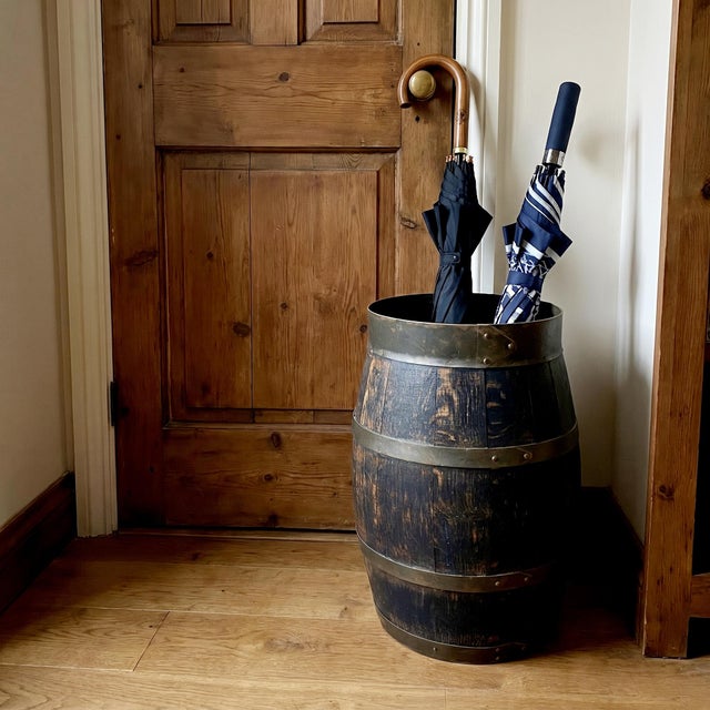 An authentic Dutch antique umbrella stand from the late 19th century, crafted in traditional barrel form from dark aged...