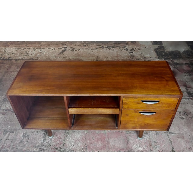 Jens Risom Danish mid-century modern walnut credenza, circa 1950s. A beautiful piece that will add to your décor!
