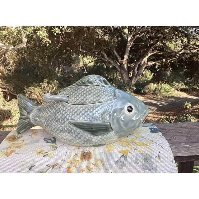 This 1950s Vintage Majolica Fish Tureen with Ladle is a striking example of mid-century craftsmanship, featuring vibrant...