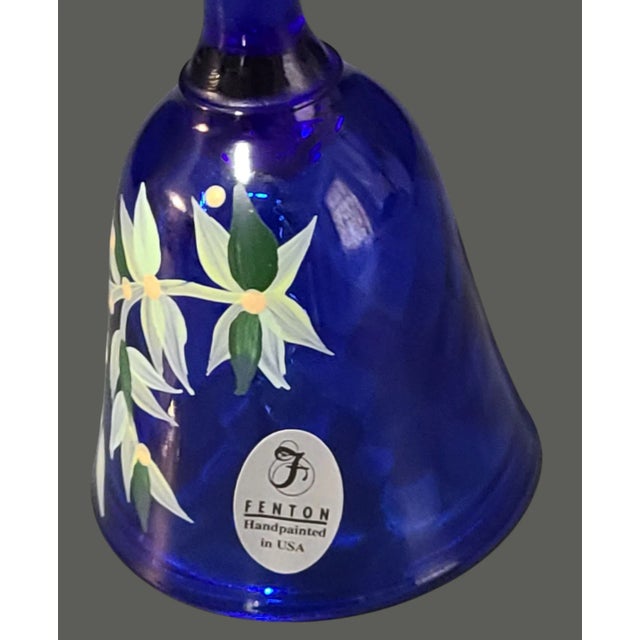 Experience the charm of yesteryear with this exquisite Vintage Fenton Glass Bell, a true testament to the timeless...