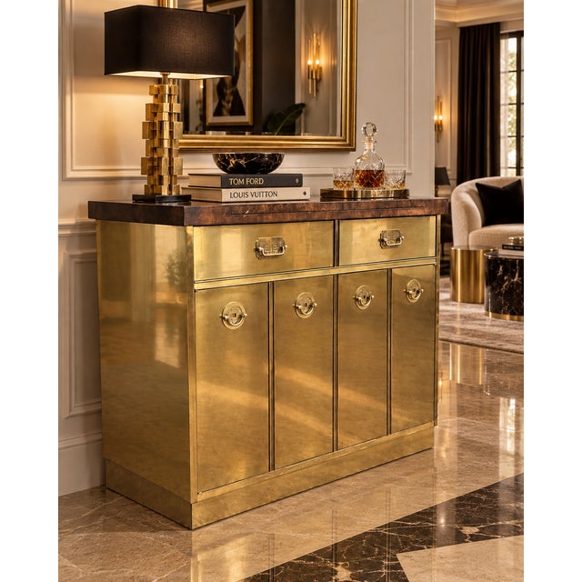 Striking 1970s brass and burl wood bar cabinet attributed to Mastercraft, featuring the bold material contrast and refined...