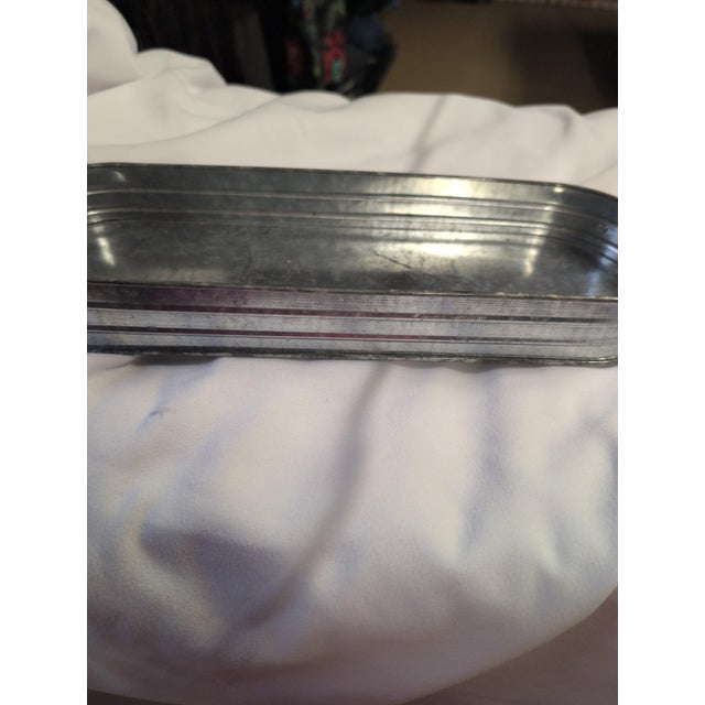 Vintage rectangular metal tray with a classic design. • Made from durable metal • Features a ribbed design for added...