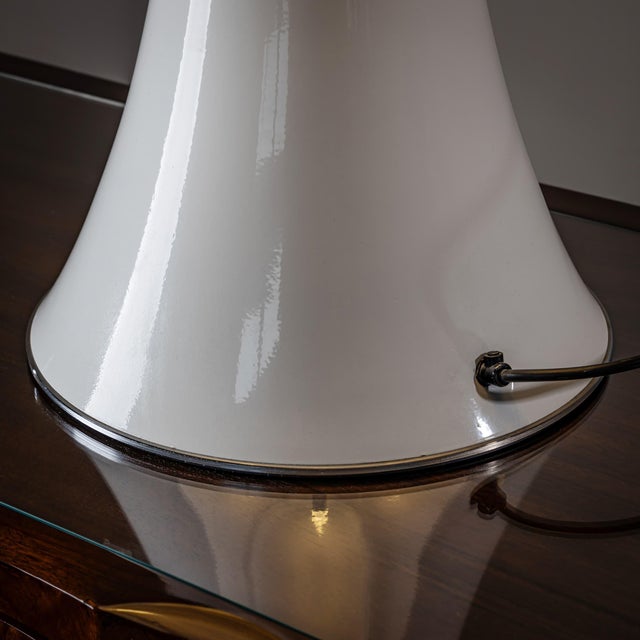 A pair of large "Pipistrello" model table lamps designed by Gae Aulenti for Martinelli Luce. Height adjustable. Marked on...