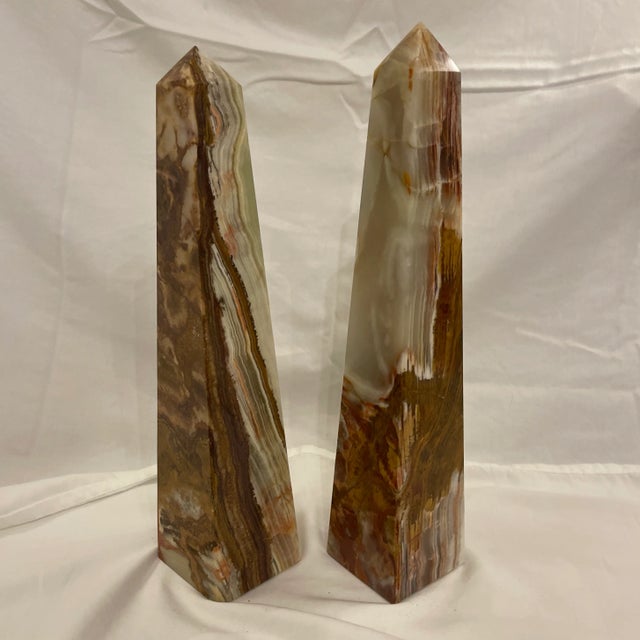 Impressive large pair of polished green and brown onyx obelisks. Great classical design, perfect on a mantle, table,...
