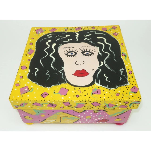 Everything about this artist made box just screams 1980’s…from the new wave style to the kitsch factor. The painted paper...