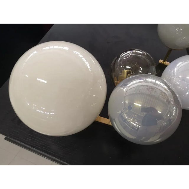 Unsurpassed design for this wall light which features a series of six lights along a beautiful brass structure....