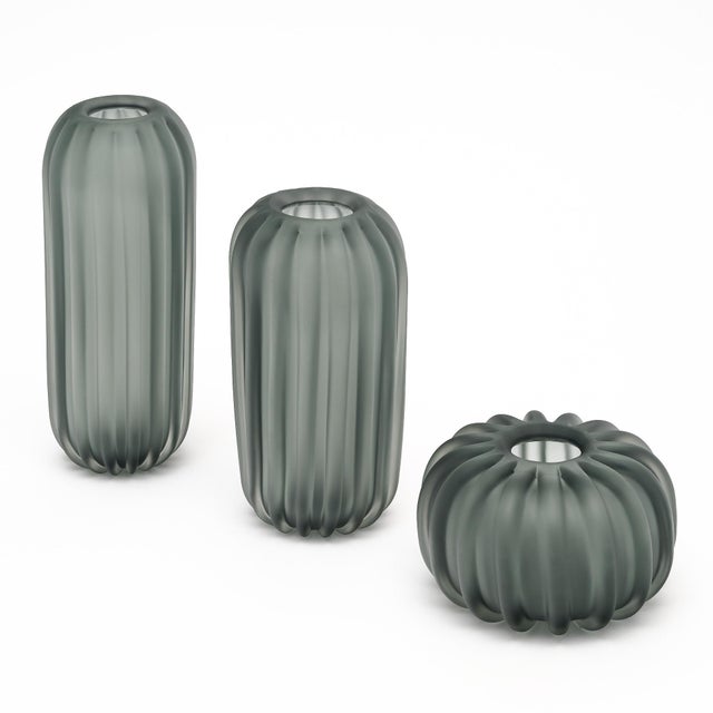 Set of three gray vases made of hand-blown Murano glass vases. Each vase differs in size, yet has the striking fluted...