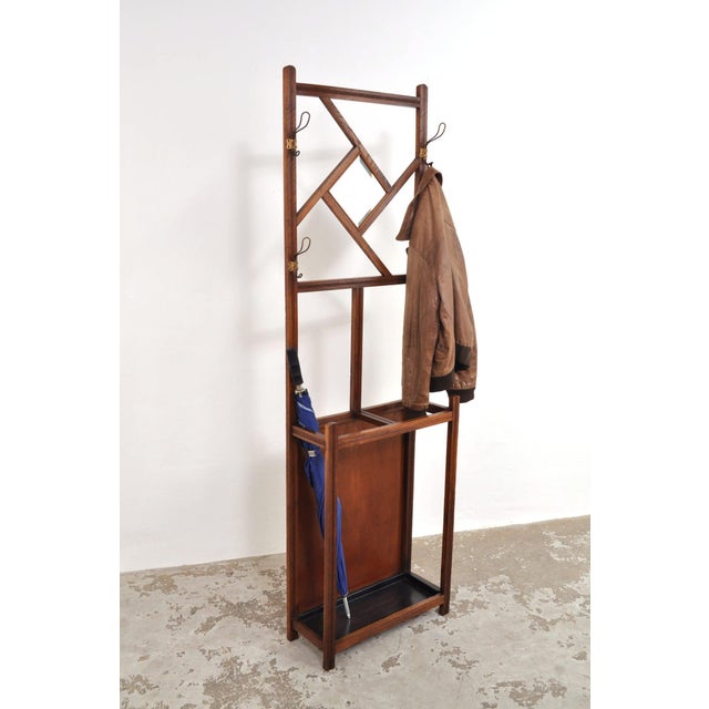 Beautiful Art Nouveau coat rack. Oak, dating from the 1900s. The coat rack features a facet-cut mirror, four double hooks,...