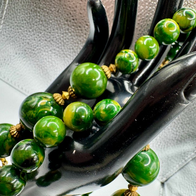 1950s Bakelite Pendant Necklace With Green and Yellow Marbled Beads and a Gold Tone Monkey Pendent Holding Beads Excellent Pre Owned Condition For Sale - Image 9 of 12