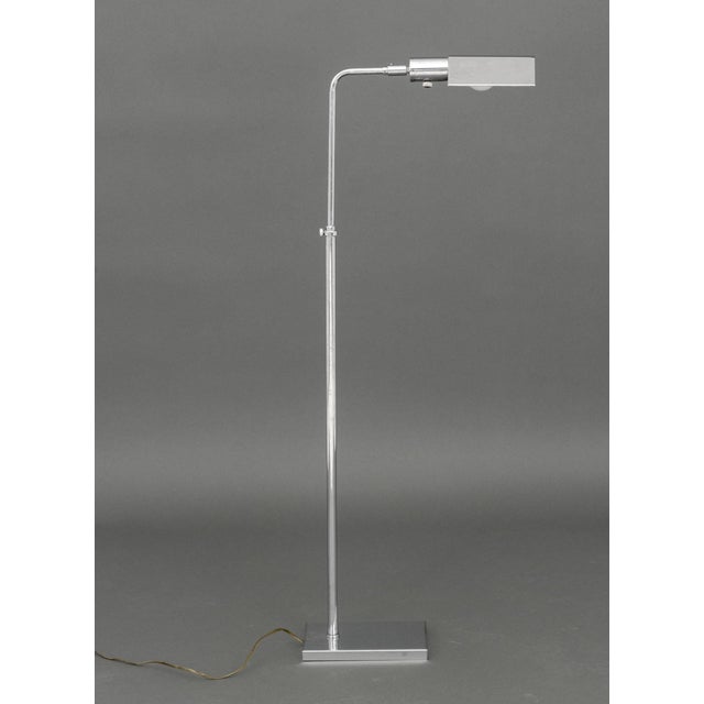 OMI Chrome-Plated Adjustable Floor Lamp, marked "OMI" to the top. 45" H x 17" W x 6.25" D. Provenance: The Estate of...