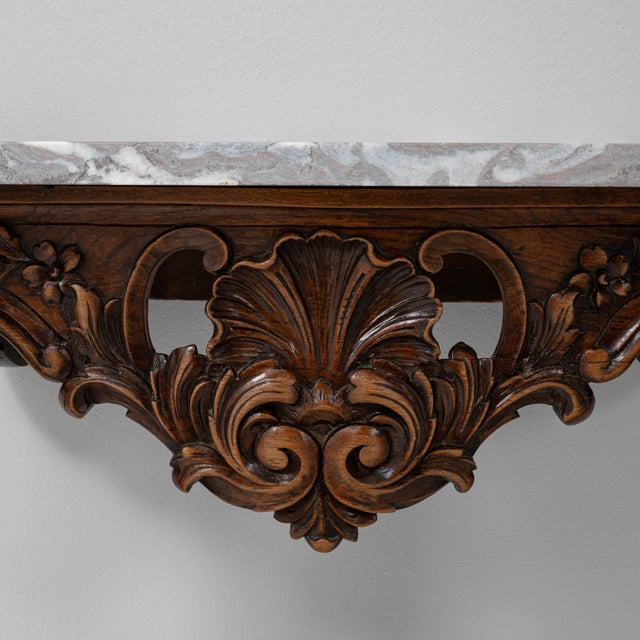 This 19th Century French console table is a striking example of Rococo-inspired craftsmanship, featuring an intricately...