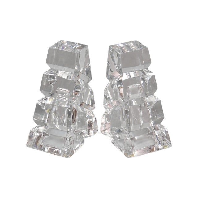 A pair of post-modern lead crystal bookends by Rogaska. Hand crafted wedge shapes are hollowed with soft bubble-like...