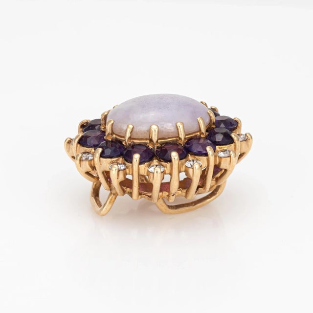 Finely detailed vintage lavender jade, amethyst & diamonds pendant crafted in 14 karat yellow gold (circa 1970s to 1980s)....