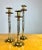 A stylish set of three well-made decorative candlestick holders, likely made by Maitland Smith (unsigned). Brass with...