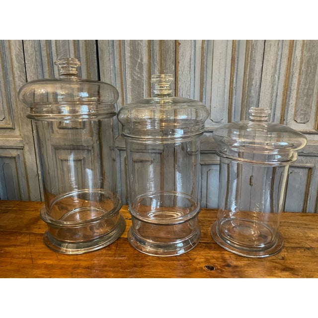 A set of three antique French candy bowls from the 19th century. They are mouth-blown and all three have beautiful lids....