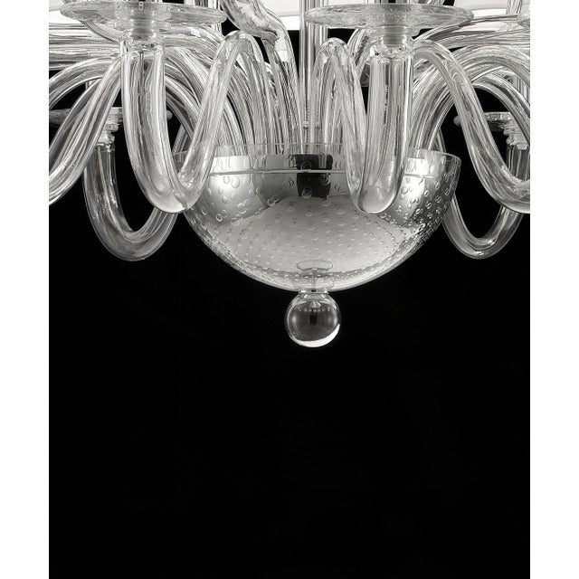 Contemporary luxury italian chandelier in Murano glass. Elegant chandelier in transparent glass made in Murano and chromed...