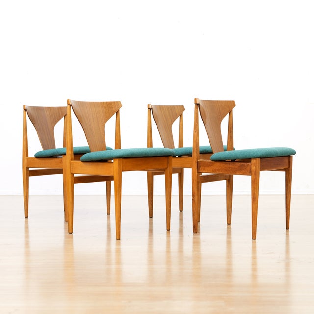 This stunning set of four dining chairs were designed and produced by 'Elliots of Newbury' of Berkshire, England during...