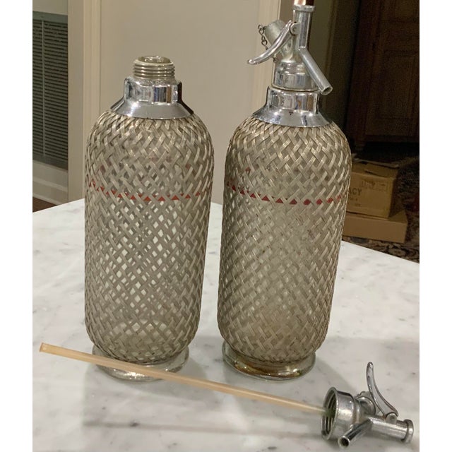 Mid 20th Century Sparklets Ltd. London, English Seltzer Bottles / Soda Siphons With Original Straws, Red Fill Bands & Woven Metal Mesh - Mid-20th Century Pair For Sale - Image 5 of 12