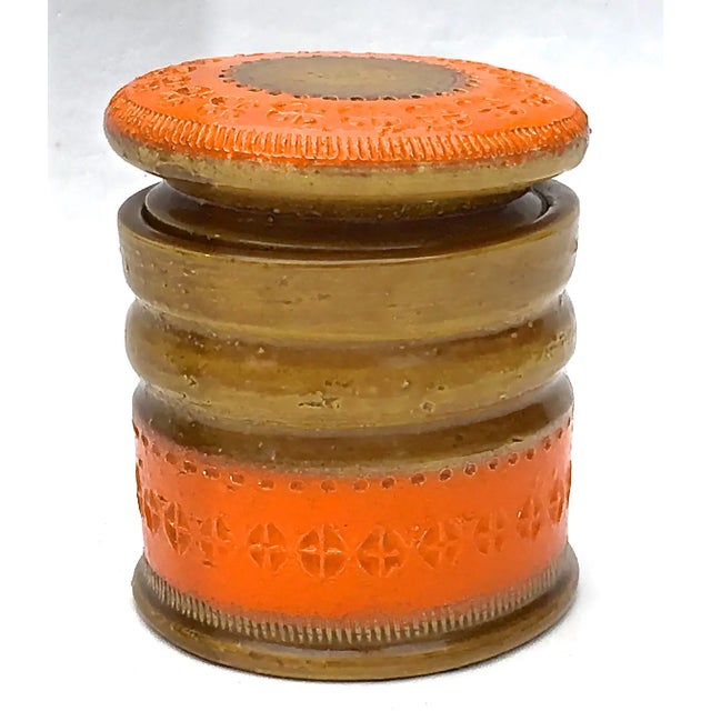 Mid-Century Modern lidded jar by Bitossi for Raymor. Textured ceramic glazed surface with orange glazed geometric...