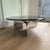 LIKE NEW Roche Bobois Alto Coffee Table The polished cast aluminum base of this striking table was inspired by a ship’s...