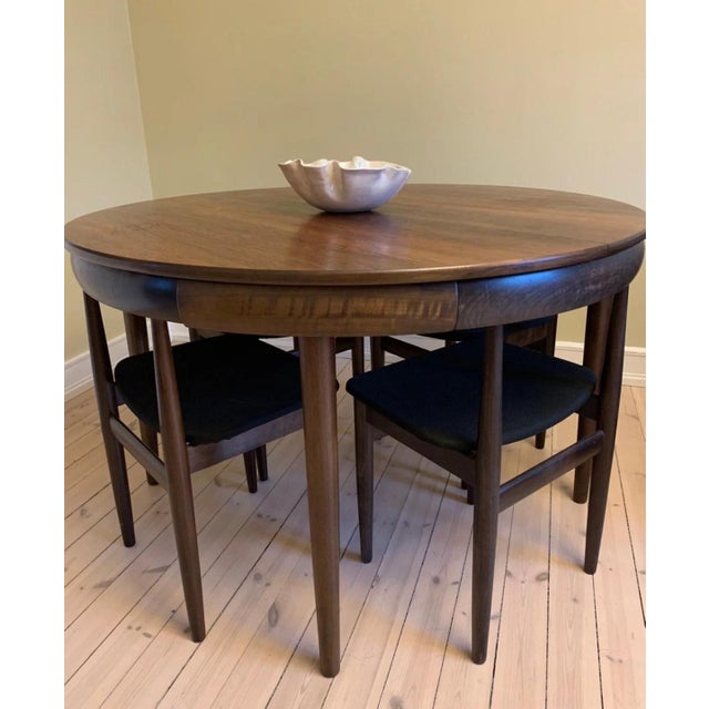 Bring iconic Scandinavian design into your home with this rare 1960s Roundette dining set by Hans Olsen for Frem Røjle,...
