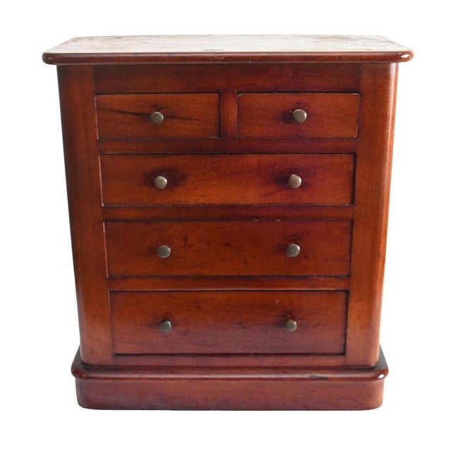 Charming apprentice piece modelled as a traditional full-sized victorian chest crafted in mahogany with two short drawers...