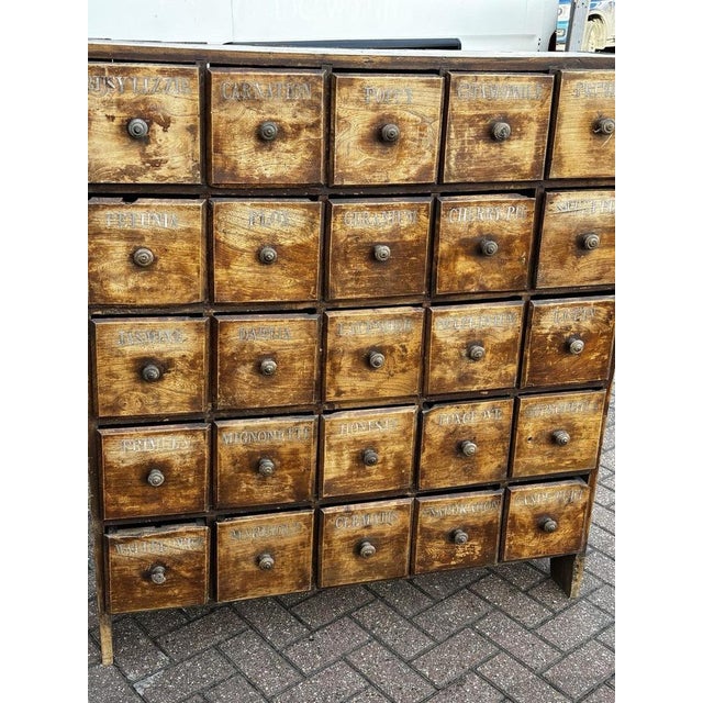 Large Floor Standing Old Pine Bank Of Shop Drawers. 25 Deep Drawers Each drawer with a painted of what was inside. 125.5...