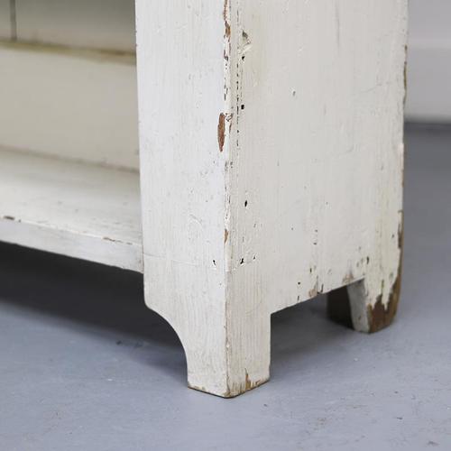 Antique, primitively constructed shelving unit with shelves, dating from around 1900. Painted in a cream-white color that...