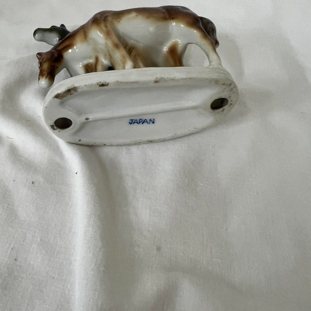 Figurine featuring a mare and colt standing together. Measures 4.5” w x 2.5” d x 4” h.