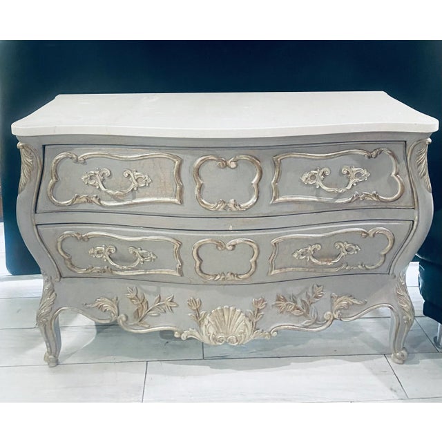 Spectacular Italian Hand-carved with white marble top Louis XV style shaped chest with two drawers finished with a...