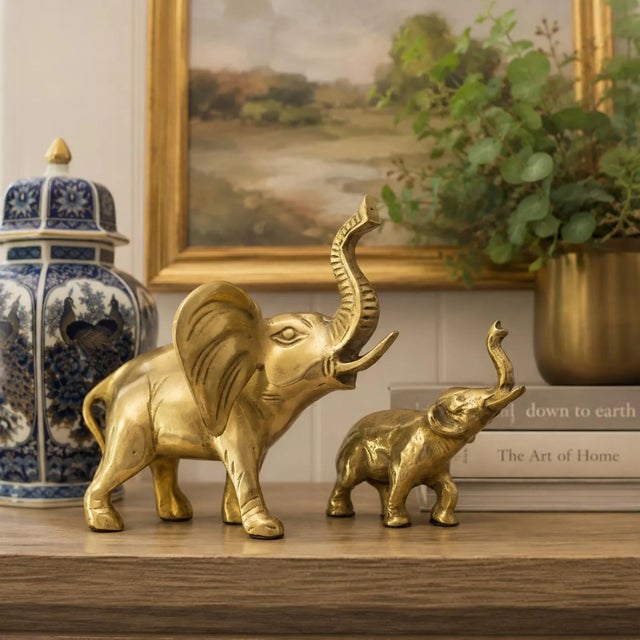 Add timeless character to your home with this vintage pair of solid brass elephant figurines. Professionally cleaned and...