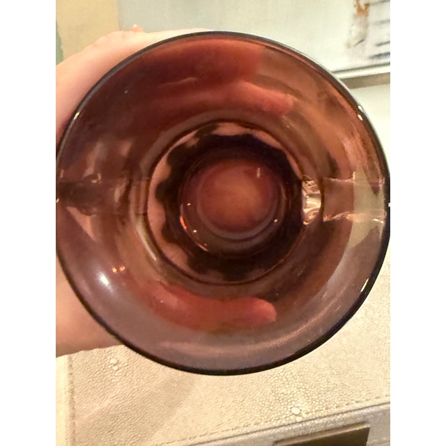 Enhance your home decor with this elegant glass vase. Its rich color adds a touch of sophistication to any room. Excellent...