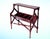 This striking Edwardian/Regency style reproduction book trough console table features solid mahogany construction with...