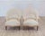 Elegant pair of French chairs from the early 20th century, displaying graceful curves and refined proportions. Carefully...