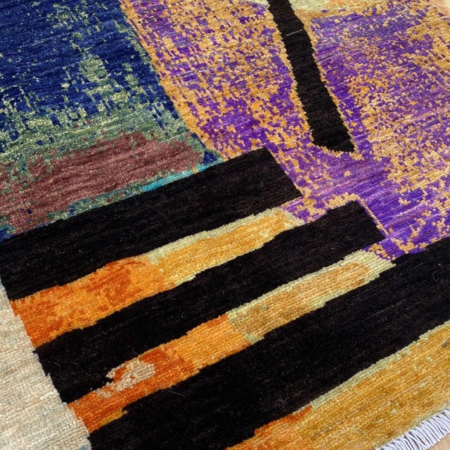 After Wassily Kandinsky — a striking hand-knotted modern art rug inspired by the abstract geometric compositions of...