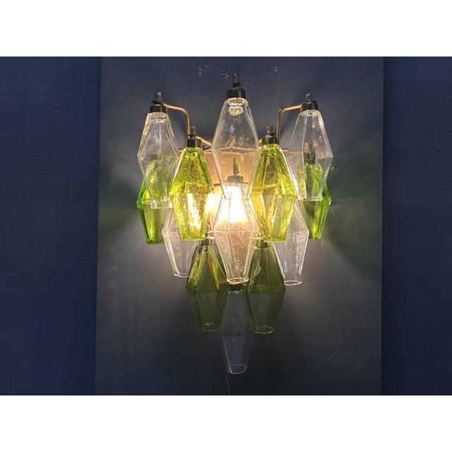 This exquisite pair of Italian wall sconces, dating from the 1980s, is a stunning example of late-century Murano glass...