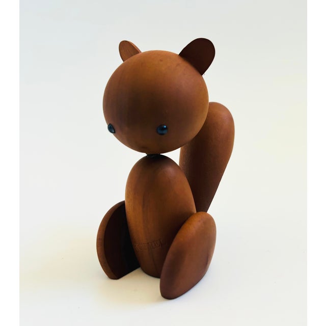 A mid century turned wood figurine in the shape of a squirrel. Adorable stylized features. Made in Japan by Senshukai as...