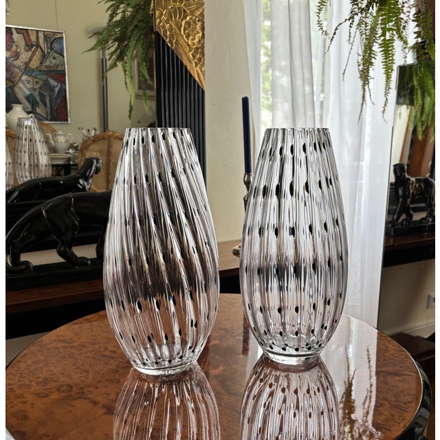 Murano glass vase in clear glass with black inclusions, heavy quality. The vases are handmade and therefore have the...