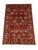 This Sultani-style rug features a Persian-inspired floral design across a deep red field. Flowers, leafy vines, and small...