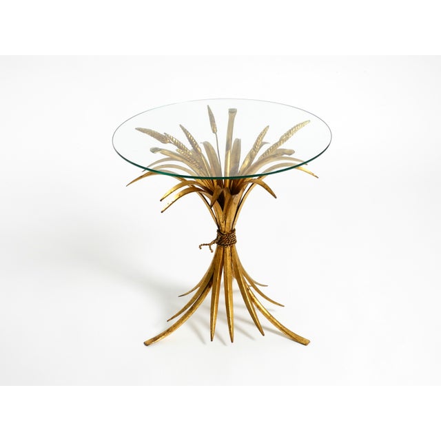 Beautiful 1960s gilt florentine regency side table or nightstand. a true classic among floral-themed tables. Designed and...