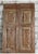 A stunning pair of antique hand-carved wooden French doors celebrating timeless craftsmanship and heritage design. Rich in...