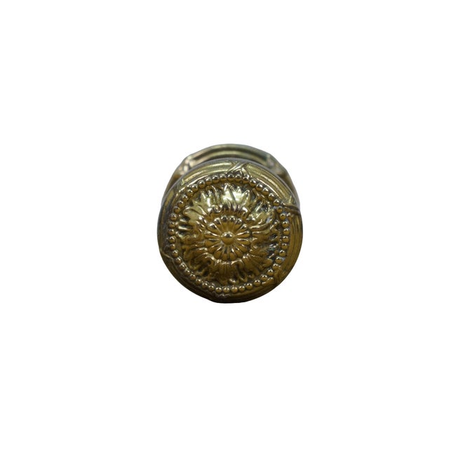 Nine vintage ornate, round brass door / cabinet / dresser pulls with backplate featuring a central floral medallion and an...