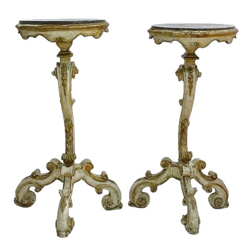 Pair of hand painted antique carved Italian scroll work and marble pedestals with gilt accents in the Florentine manner....
